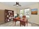 Home office featuring desk, chair, shelving, laptop, and natural light at 181 Tracy Ridge Blvd, Whiteland, IN 46184