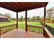 Covered patio with scenic views of the pond and neighboring homes surrounded by lush landscaping at 181 Tracy Ridge Blvd, Whiteland, IN 46184