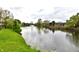 Picturesque pond view with a fountain, surrounded by mature trees and landscaping at 181 Tracy Ridge Blvd, Whiteland, IN 46184