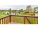 Scenic view of a pond from a private balcony, surrounded by lush landscaping and neighboring homes at 181 Tracy Ridge Blvd, Whiteland, IN 46184