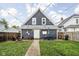 Backyard featuring green grass, fire pit, patio, and outdoor seating, perfect for relaxing and entertaining at 1852 Singleton St, Indianapolis, IN 46203