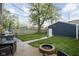 Inviting backyard with lush lawn, fire pit, and outdoor dining area, perfect for entertaining at 1852 Singleton St, Indianapolis, IN 46203