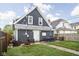 Backyard featuring green grass, fire pit, patio, and outdoor seating, perfect for relaxing and entertaining at 1852 Singleton St, Indianapolis, IN 46203