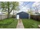 Backyard featuring green grass and a shed, creating a serene outdoor space at 1852 Singleton St, Indianapolis, IN 46203