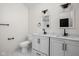 Well-lit bathroom features a dual sink vanity with modern fixtures and a stylish mirror at 1852 Singleton St, Indianapolis, IN 46203