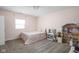 Pink bedroom featuring carpet flooring, dollhouse, and a queen size bed at 1852 Singleton St, Indianapolis, IN 46203