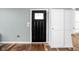 Entryway featuring a black front door and built-in white storage cabinets at 1852 Singleton St, Indianapolis, IN 46203