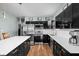Modern kitchen featuring stainless steel appliances and sleek black cabinetry at 1852 Singleton St, Indianapolis, IN 46203