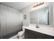 Clean bathroom with a large mirror above the sink and a shower with a curtain at 1909 Orange St, Indianapolis, IN 46203