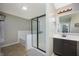Modern bathroom featuring a tiled shower with a glass door and a dark wood vanity at 1909 Orange St, Indianapolis, IN 46203