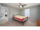 Cozy bedroom featuring a metal frame bed with a colorful quilt and a ceiling fan at 1909 Orange St, Indianapolis, IN 46203