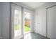 Bright room with sliding glass doors that open to the backyard, carpeted floors, and closet at 1909 Orange St, Indianapolis, IN 46203