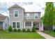Charming two-story home with a well-manicured lawn and inviting front porch at 1909 Orange St, Indianapolis, IN 46203