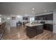 Well-lit kitchen with island seating and modern stainless appliances at 1909 Orange St, Indianapolis, IN 46203