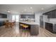 Spacious kitchen featuring an island, modern stainless appliances, and a breakfast table at 1909 Orange St, Indianapolis, IN 46203