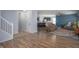 Open-concept living space with hardwood floors seamlessly flows into the kitchen at 1909 Orange St, Indianapolis, IN 46203