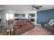 Cozy living room with comfortable seating, a ceiling fan, and lots of natural light at 1909 Orange St, Indianapolis, IN 46203