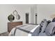 Bright bedroom featuring three decorative mirrors above a wooden dresser and an abundance of natural light at 2242 Hemlock Cir, Greenfield, IN 46140