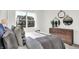Bedroom view showcasing exterior property with large window, as well as decorative mirrors at 2242 Hemlock Cir, Greenfield, IN 46140