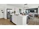 Kitchen featuring a stainless steel refrigerator and center island overlooking the living room at 2242 Hemlock Cir, Greenfield, IN 46140