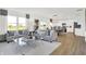 Open living space showcases a gray sofa with a dining table and modern kitchen nearby at 2242 Hemlock Cir, Greenfield, IN 46140