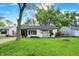 Charming single-story home with a well-manicured lawn, fresh landscaping, and bright, natural light at 2307 Magnolia Pl, Indianapolis, IN 46219