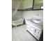 Bathroom featuring a vintage clawfoot tub and a vanity with marble-look countertop at 2414 S Rybolt Ave, Indianapolis, IN 46241