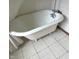 Clawfoot bathtub features a vintage design and a white shower curtain at 2414 S Rybolt Ave, Indianapolis, IN 46241