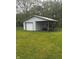 View of garage with a covered space in the backyard at 2414 S Rybolt Ave, Indianapolis, IN 46241