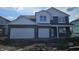 New two-story home showcasing a brick and siding facade with a two-car garage, plus bright white trim at 2698 Nampa Dr, Whitestown, IN 46075