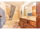 Bathroom with a shower-tub combo, and vanity with light colored countertop at 3003 Foxpointe Dr, Columbus, IN 47203