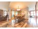 Bright dining area with wood table and chairs, adjacent to the living room and kitchen at 3003 Foxpointe Dr, Columbus, IN 47203