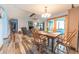 Bright dining area with wood table and chairs, adjacent to the living room and kitchen at 3003 Foxpointe Dr, Columbus, IN 47203