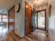 Inviting entryway with wood-look floors, featuring a door with glass and a closet on the left at 3003 Foxpointe Dr, Columbus, IN 47203