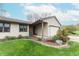 Welcoming front of home with stone landscaping, an attached garage, and vinyl siding at 3003 Foxpointe Dr, Columbus, IN 47203