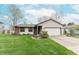 Charming home with a well-manicured lawn and an attached two-car garage at 3003 Foxpointe Dr, Columbus, IN 47203
