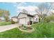 Detached single car garage with white door, side entry, and nice landscaping at 3003 Foxpointe Dr, Columbus, IN 47203