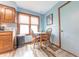 Charming eat-in kitchen area featuring a small table set for two near a window with natural light at 3003 Foxpointe Dr, Columbus, IN 47203