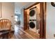 Modern stacked washer and dryer setup in a dedicated laundry area near the kitchen at 3003 Foxpointe Dr, Columbus, IN 47203