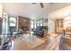 Comfortable living space with a brick fireplace, wood flooring, and natural light at 3003 Foxpointe Dr, Columbus, IN 47203