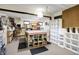 Functional basement space featuring custom work tables and storage solutions, perfect for hobbies or crafts at 3154 E German E Rd, Shelbyville, IN 46176