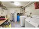 Basement laundry room with a washer, dryer, utility sink, and water heater for convenience at 3154 E German E Rd, Shelbyville, IN 46176