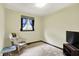 Comfortable bedroom featuring a quaint chair and a television, enhanced by a plush carpet at 3154 E German E Rd, Shelbyville, IN 46176