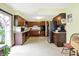 Functional kitchen with stainless steel appliances, wooden cabinetry, and easy access to an outdoor area at 3154 E German E Rd, Shelbyville, IN 46176
