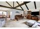 Open living space with exposed beams, comfortable seating, and seamless flow to the dining area at 3154 E German E Rd, Shelbyville, IN 46176