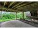 Open outdoor area under deck with a peek at the natural surroundings and plants at 3154 E German E Rd, Shelbyville, IN 46176