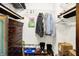 Walk-in closet with a dark-stained wooden dresser, shelving, and clothing hung from a wire rack at 3154 E German E Rd, Shelbyville, IN 46176