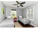 Comfortable bedroom with two twin beds, natural light, and a ceiling fan at 319 S Randolph St, Indianapolis, IN 46201