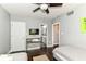 This bedroom features a ceiling fan, a desk with a TV and convenient access to the bathroom at 319 S Randolph St, Indianapolis, IN 46201