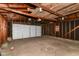 This garage offers a spacious interior, exposed framing, and a concrete floor at 319 S Randolph St, Indianapolis, IN 46201